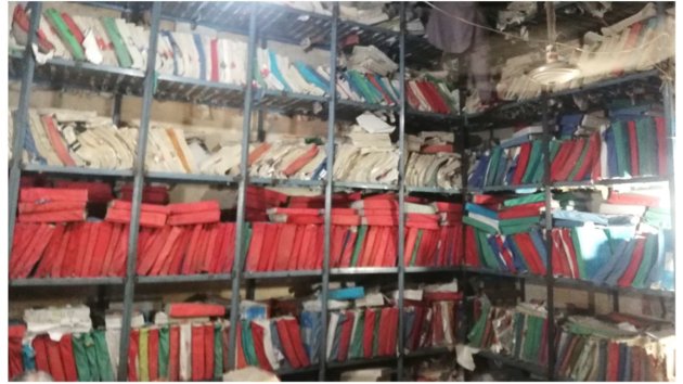 A picture of filed documents on bookshelves