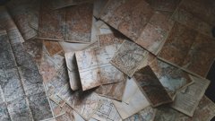 a collection of paper maps