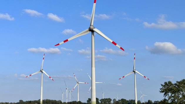 A picture of wind turbines in the countryside