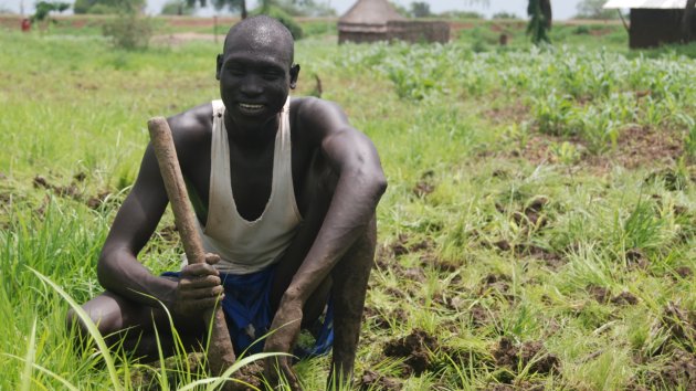 A farmer planting on his land in Ethiopia