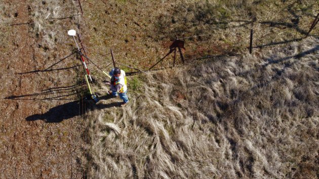 an overhead picture of a person marking out cadastral boundaries